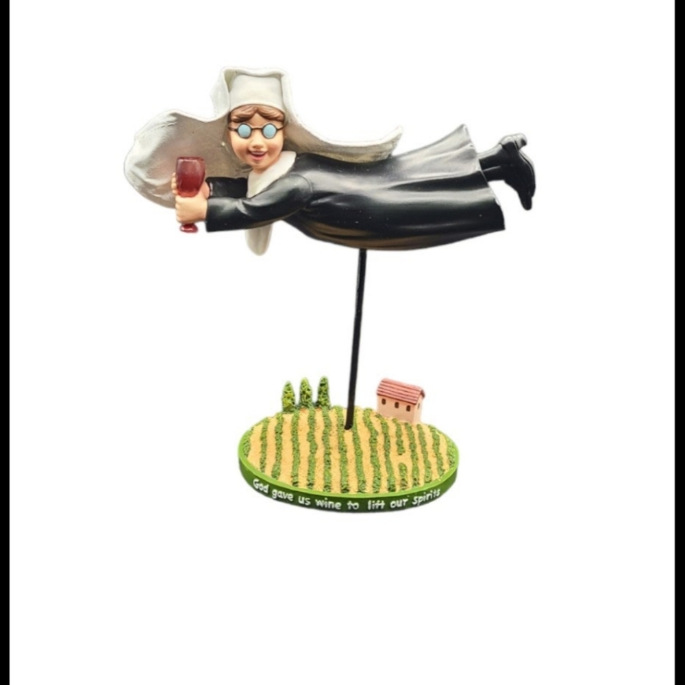 Flying nun with wine glass